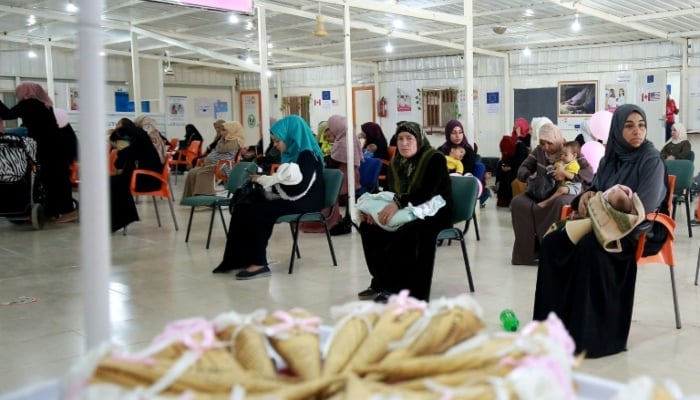 Syrian women wait for a consultation at the United Nations Population Funds clinic in the Zaatari refugee camp in Jordan. — AFP/File