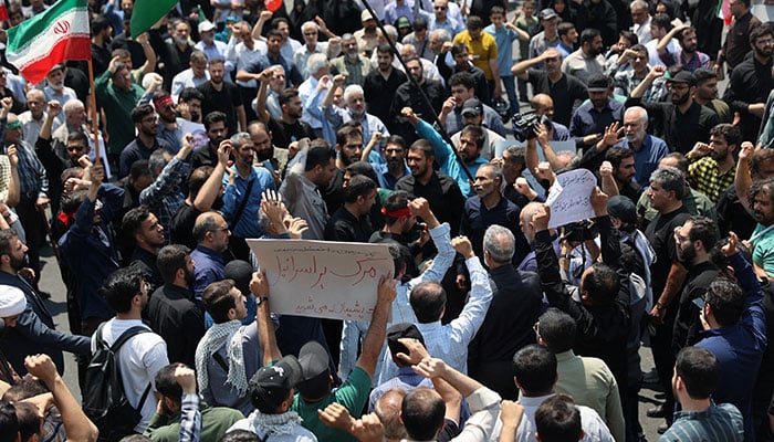 People attend an anti-Israeli protest following the Israeli strikes on Iran, in Tehran, Iran, June 13, 2025. — Reuters